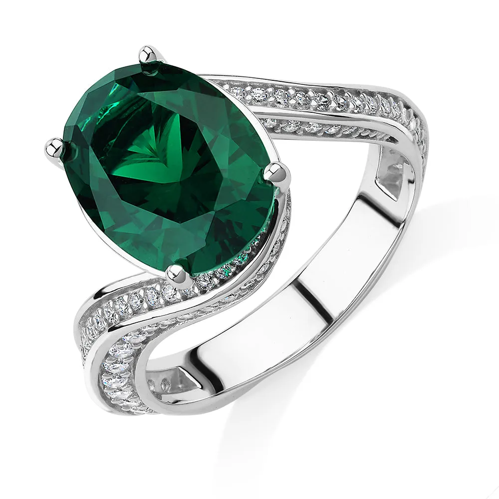 Dress ring with emerald simulant and 0.82 carats* of diamond simulants in sterling silver