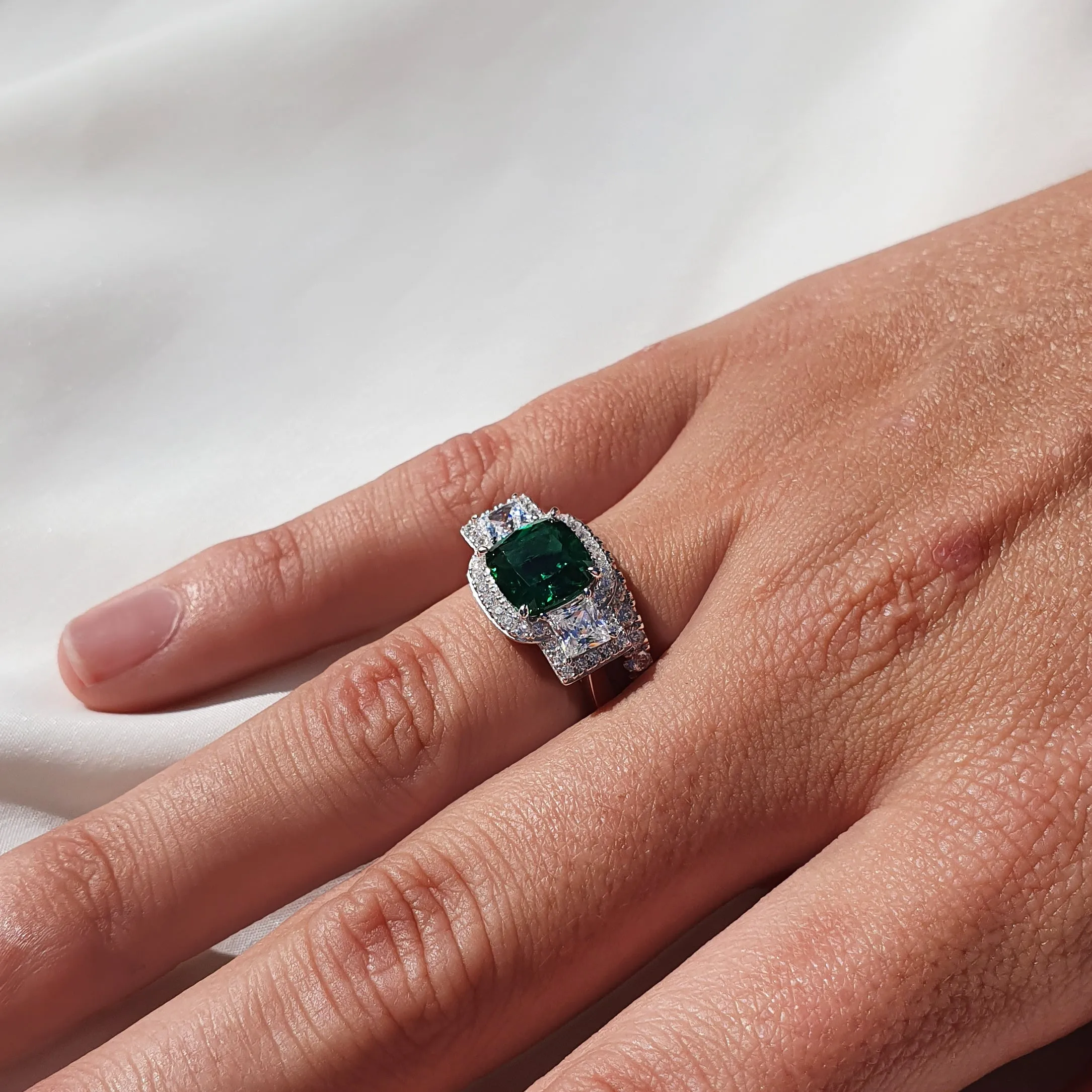 Dress ring with emerald simulant and 0.99 carats* of diamond simulants in sterling silver