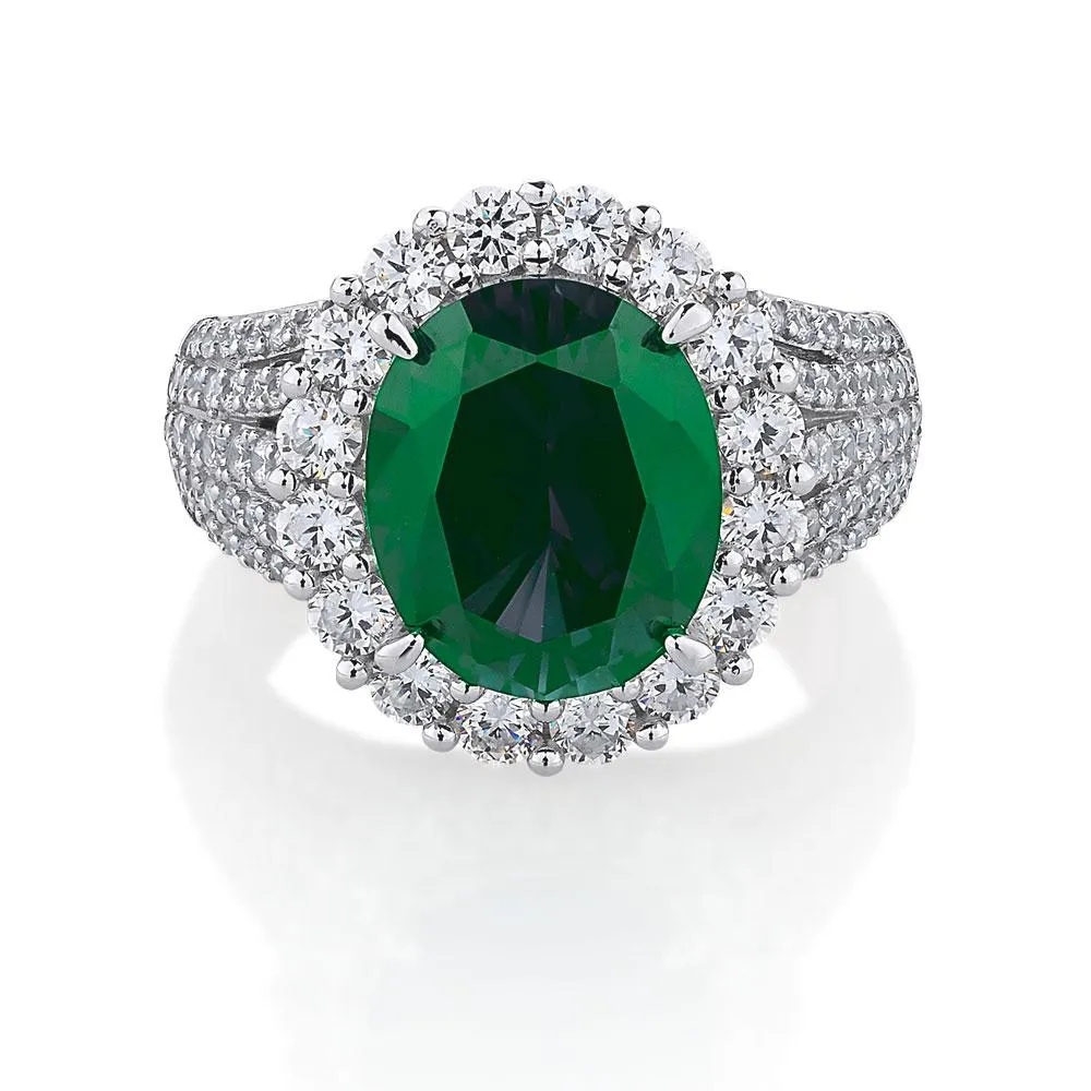 Dress ring with emerald simulant and 6.35 carats* of diamond simulants in sterling silver