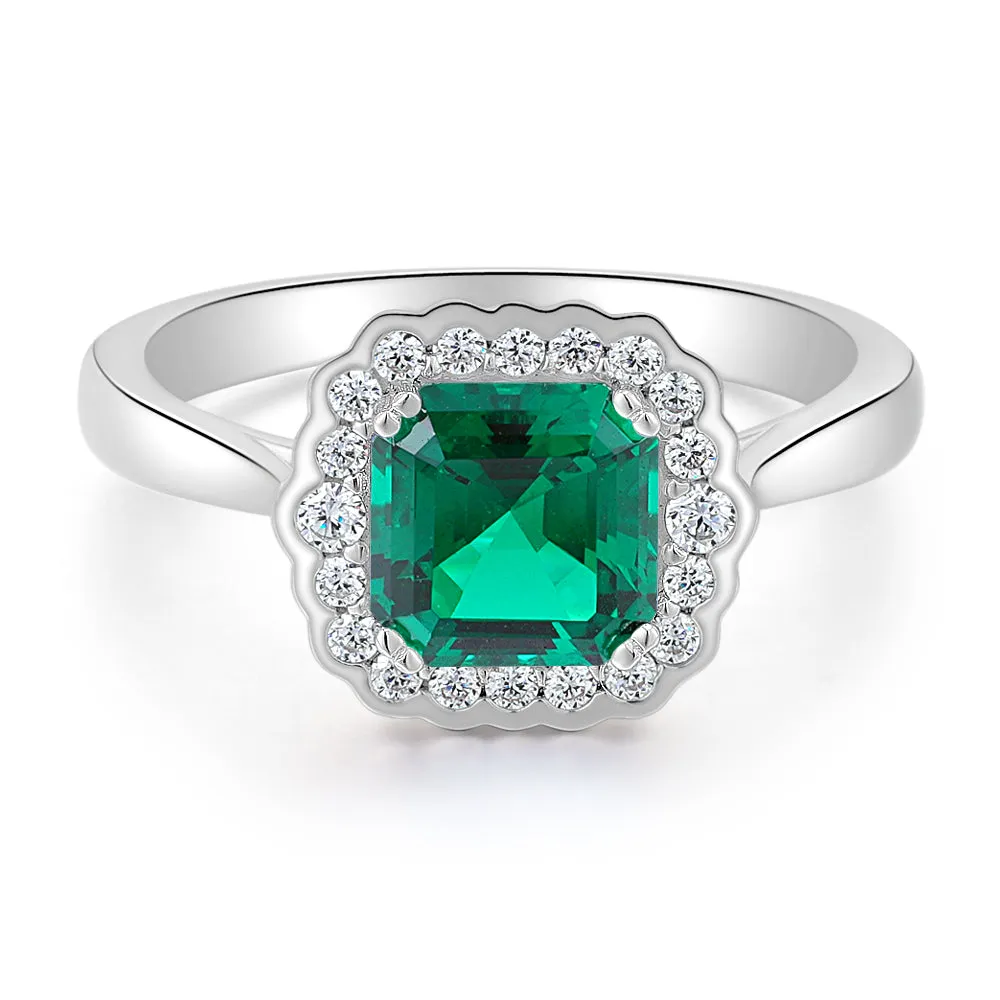 Dress ring with emerald simulant in sterling silver